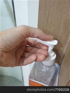 Hand of people applying alcohol spray or anti bacteria spray to prevent spread of germs, bacteria and virus.Wuhan coronavirus (COVID-19) outbreak prevention,personal hygiene concept.