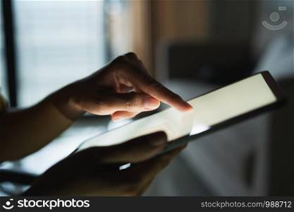 Hand of woman touch screen on modern digital tablet, Blank digital tablet white screen in the hand of Asian women
