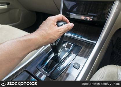 hand on automatic gear shift, Man hand shifting an automatic car