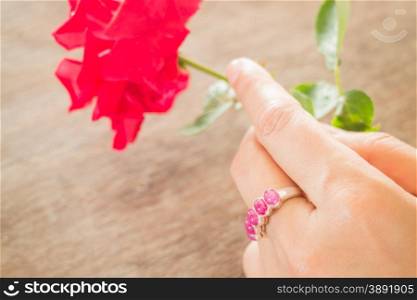 Hand on classic ruby ring, stock photo