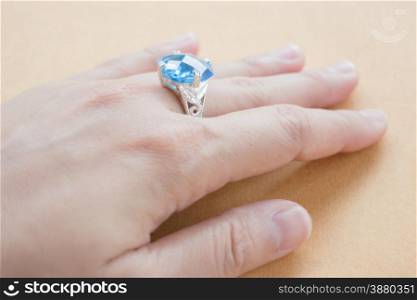 Hand on gem stone jewellery ring, stock photo