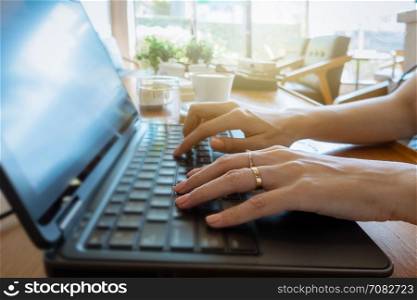 Hand on keyboard close up, business woman working on laptop in home office as agile technology concept