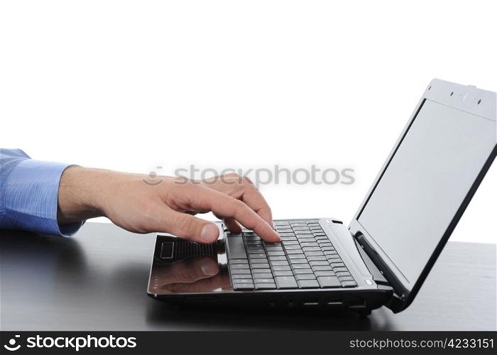 Hand on the laptop keyboard. Isolated on white