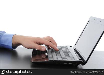 Hand on the laptop keyboard. Isolated on white