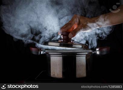hand open hot steam pot