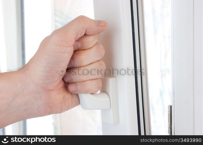 hand opens a plastic window