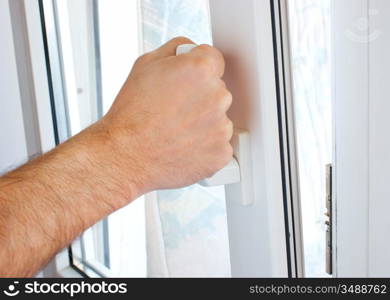 hand opens a window