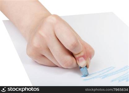 hand paints by blue pastel on sheet of paper isolated on white background
