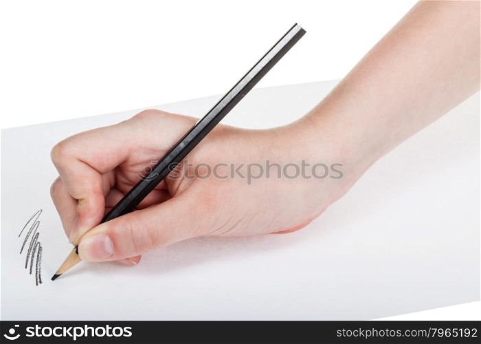 hand paints by wood black pencil on sheet of paper isolated on white background