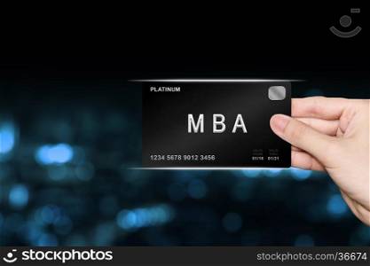 hand picking MBA or Master of Business Administration platinum card on blur background