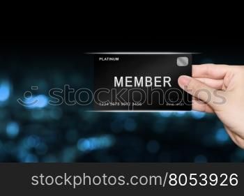 hand picking member platinum card on blur background