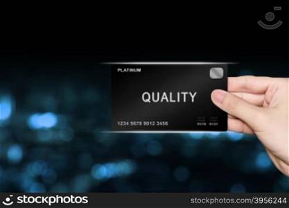 hand picking quality platinum card on blur background