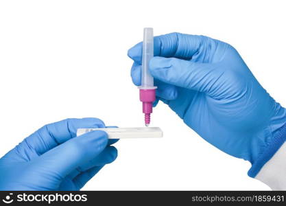 Hand placing the secretions sample into the SARS CoV-2 Rapid antigen test kit (ATK) with the extraction tube,Coronavirus infectious protective concept