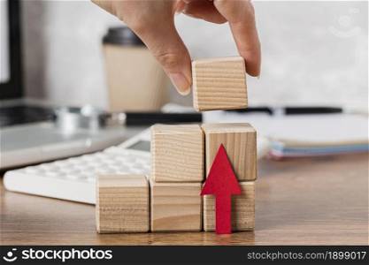 hand placing wooden block represent growth 2. Resolution and high quality beautiful photo. hand placing wooden block represent growth 2. High quality beautiful photo concept