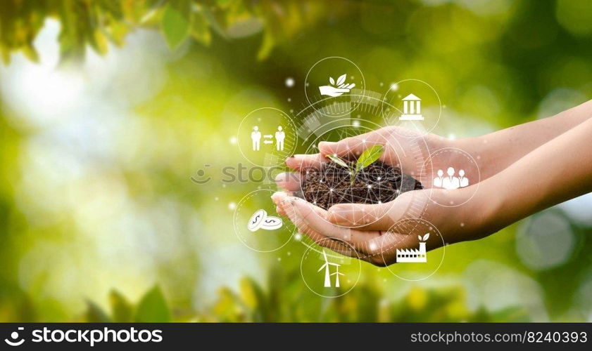 Hand planting trees with technology of renewable resources to reduce pollution ESG icon concept in hand for environmental, social and sustainable business governance.