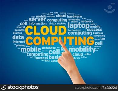 Hand pointing at a Cloud Computing Word Cloud on blue background.
