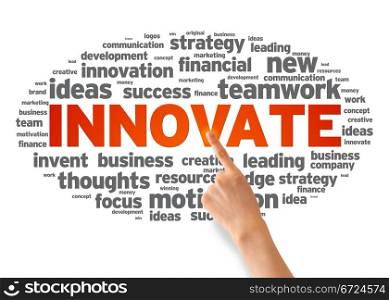 Hand pointing at a Innovate Word illustration on white background.
