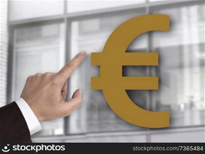 Hand pointing at Euro sign concept.. Hand pointing at Euro sign concept