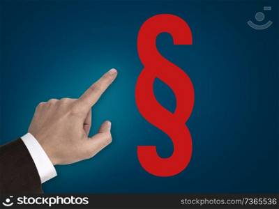 Hand pointing at paragraph sign concept.. Hand pointing at paragraph sign concept