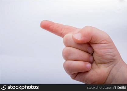 Hand pointing gesture on a white background