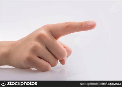 Hand pointing gesture on a white background
