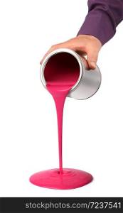 Hand pouring red pink paint from tin can isolated on white