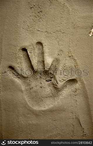 hand print on cement mortar wall with shadow relief
