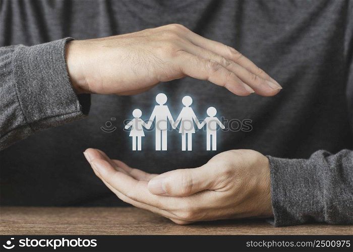 Hand protecting paper cut family figure , Health care and insurance for Protecting Family , concept for security and Medical care