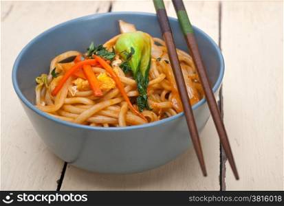 hand pulled stretched Chinese ramen noodles on a bowl with chopstick