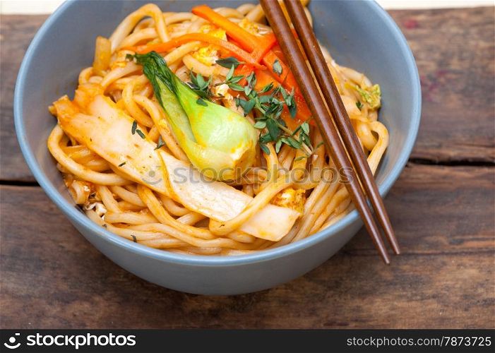 hand pulled stretched Chinese ramen noodles on a bowl with chopstick
