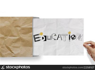 hand pulling crumpled paper from envelope with design word EDUCATION as concept