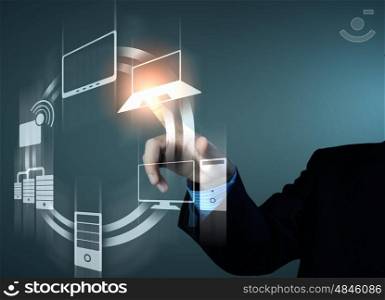 hand pushing on a touch screen. Business person pushing symbols on a touch screen interface
