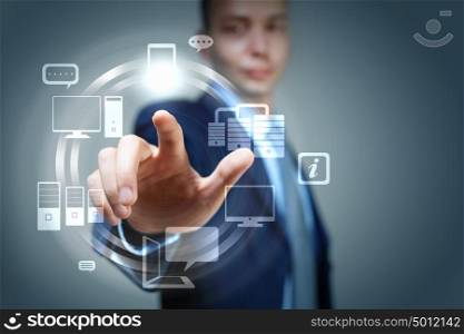 hand pushing on a touch screen. Business person pushing symbols on a touch screen interface