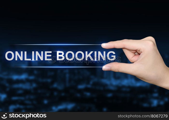 hand pushing online booking button on blurred blue background