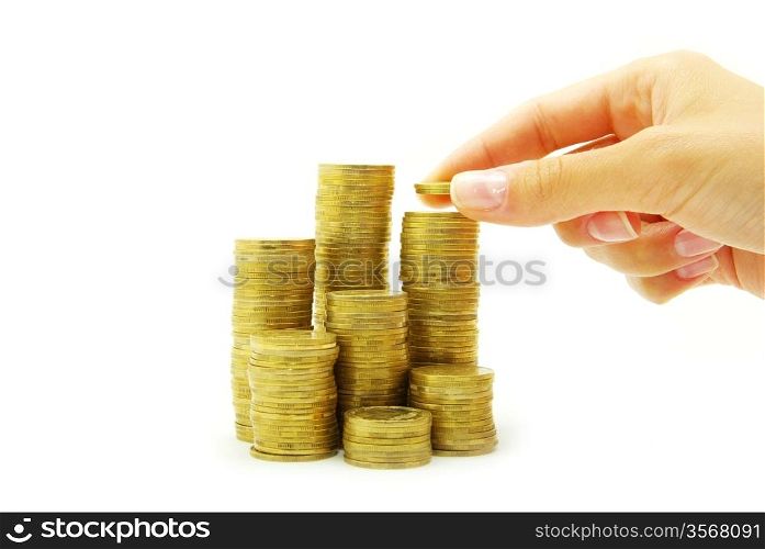 Hand put coin to money staircase isolated on white background