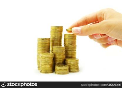 Hand put coin to money staircase isolated on white background