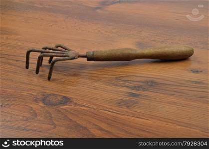 Hand rake on wood