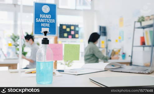 Hand sanitizer gel for hand hygiene corona virus protection back at work in home office. Social distancing and self quarantine time, coronavirus concept.