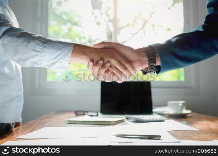 hand shaking after meeting finish in office