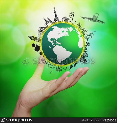 hand showing airplane traveling around the world on green nature background as concept 