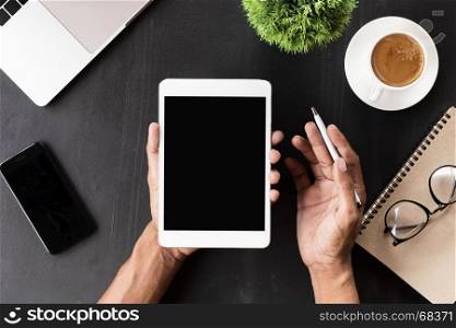 hand showing digital tablet blank screen on work desk