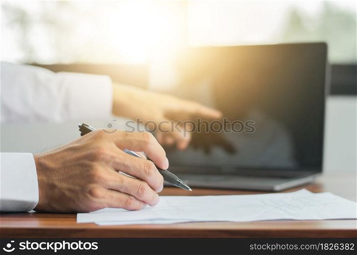 Hand signature on document , Hand holding pen writing