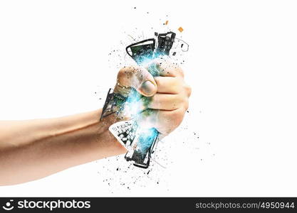 Hand squeezing keyboard. Close-up image of human hand clutching keyboard