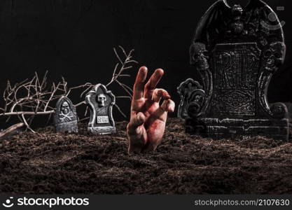 hand sticking out grave dark cemetery