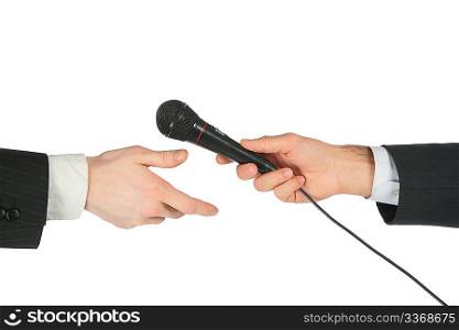 Hand takes microphone from another