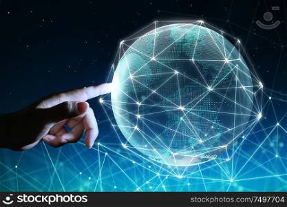Hand touching digital glass planet earth with hologram design . Global business technologies concept. Mixed media .