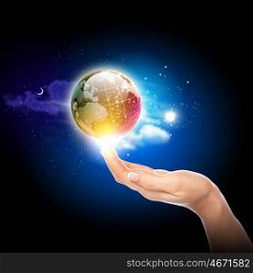 hand touching the earth. Human hand holding our planet earth glowing