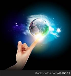 hand touching the earth. Human hand holding our planet earth glowing
