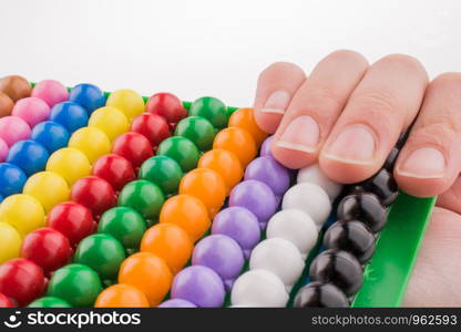 Hand using a color abacus