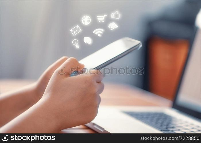 Hand using smart phone with Social media concept
